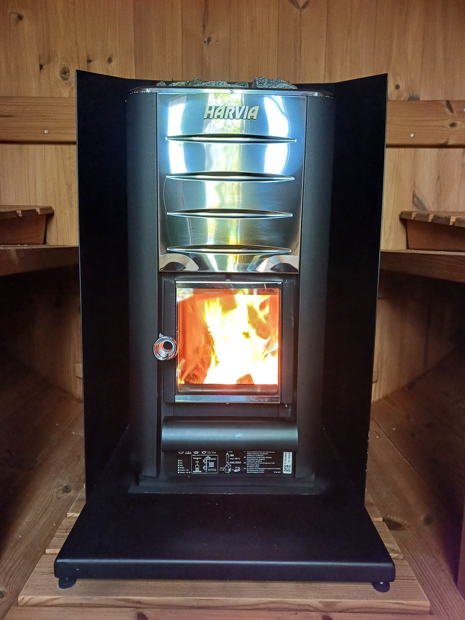 The Harvia M3 wood-fired stove alight